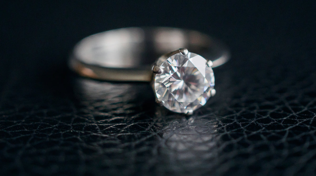 Diamond rind on a black leather surface