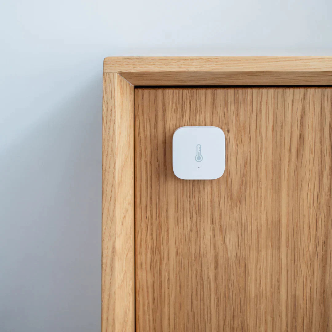 
                  
                    a wooden cabinet with a Sensor on it
                  
                