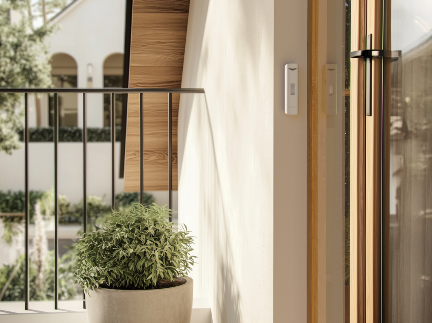 Ajax curtain motion detector installed along home entryway for perimeter protection