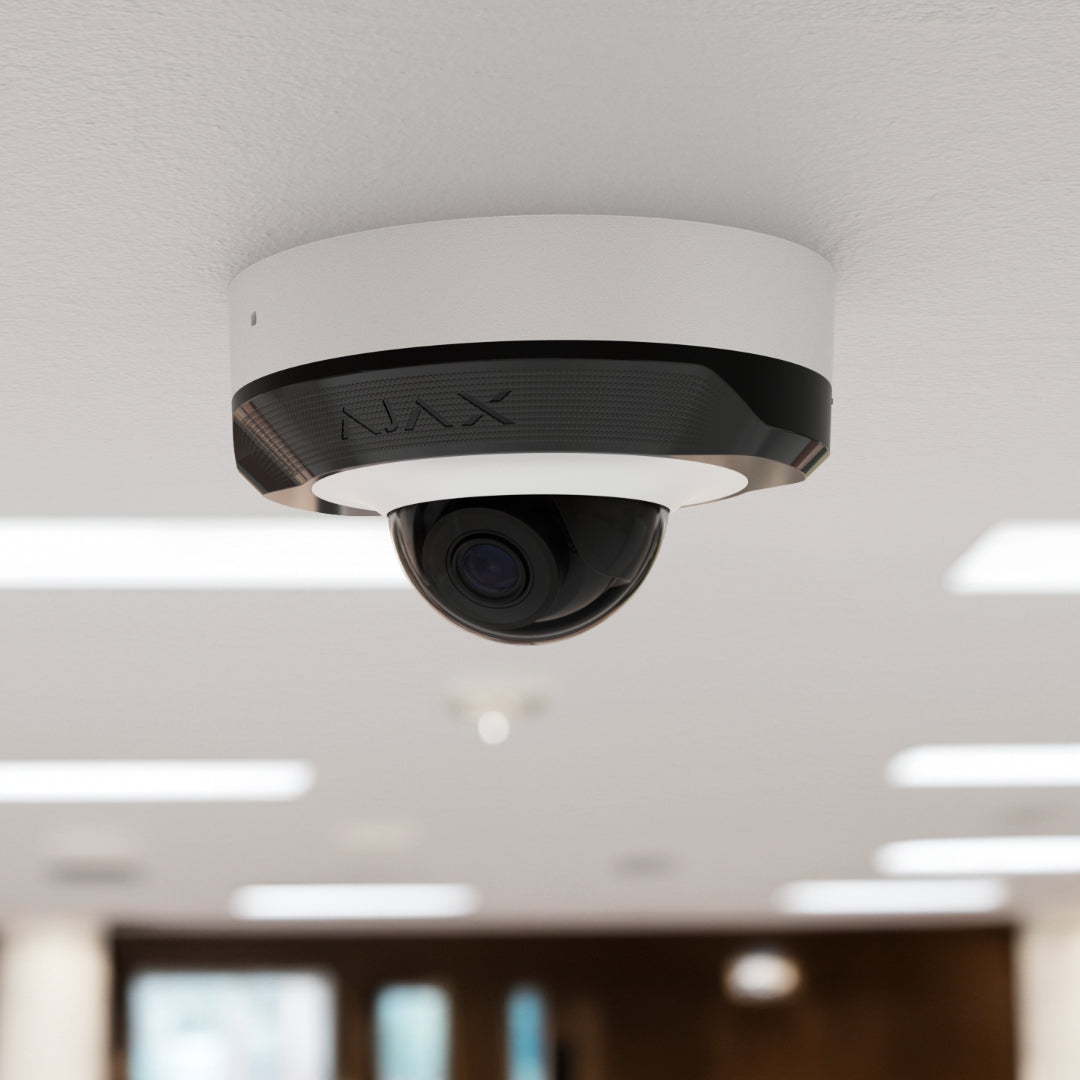 AJAX DomeCam Mini installed on a white ceiling